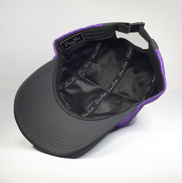 DomePeak's trek range. Introducing our activewear, fully waterproof, comes with a small, zip pocket on the side for the convenience of our active customers.Inside of the cap, purple and black 5 panel. This piece s the bent peak.