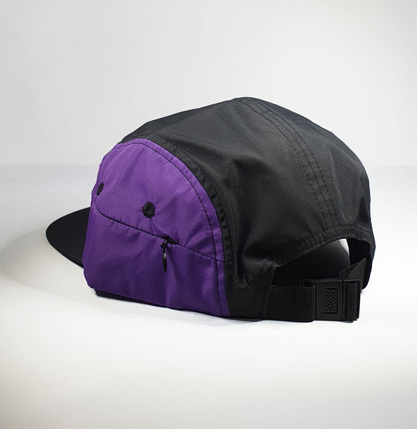 DomePeak's trek range. Introducing our activewear, fully waterproof, comes with a small, zip pocket on the side for the convenience of our active customers. Front of the cap, purple and black 5 panel. This piece s the flat peak.