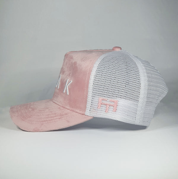 DomePeak Headwear pink suede baseball cap. Supported with a snapback to fit all sizes.Side angle of the cap.