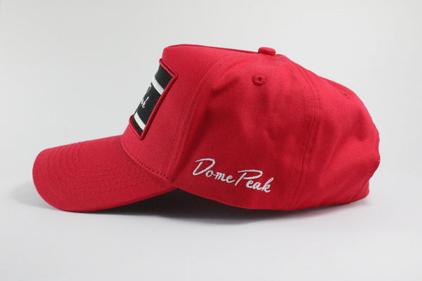 DomePeak Headwear baseball cap. Supported with a strap back to git all sizes.Side angle of the cap.